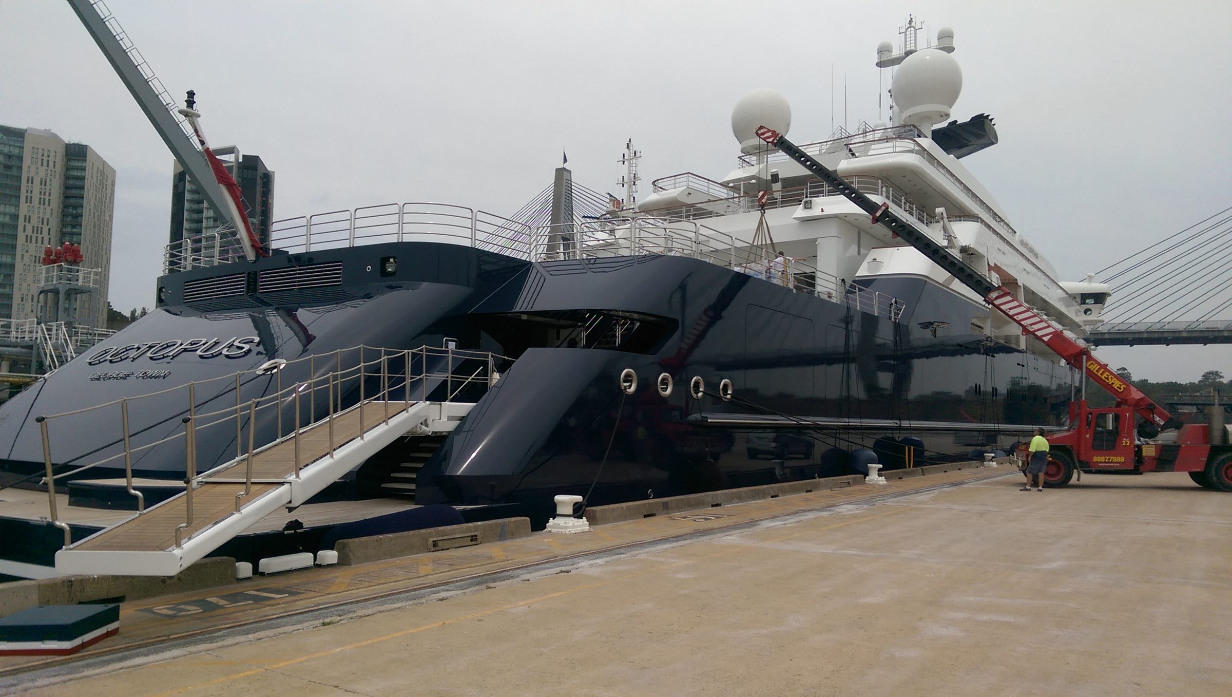 Large superyacht alongside in Sydney with a crane at the wharf