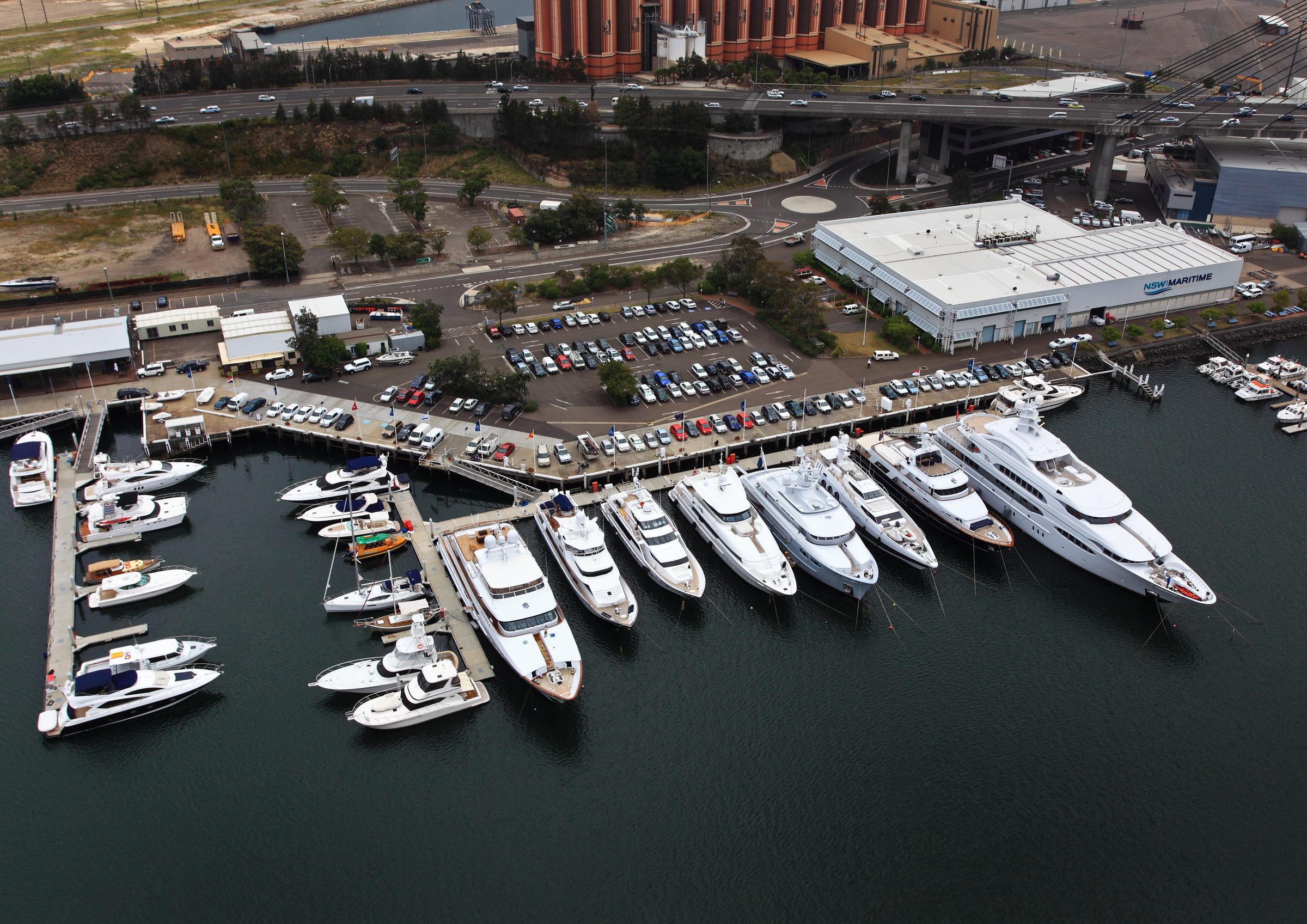 Aerial view of superyachts lined up at a Sydney marina