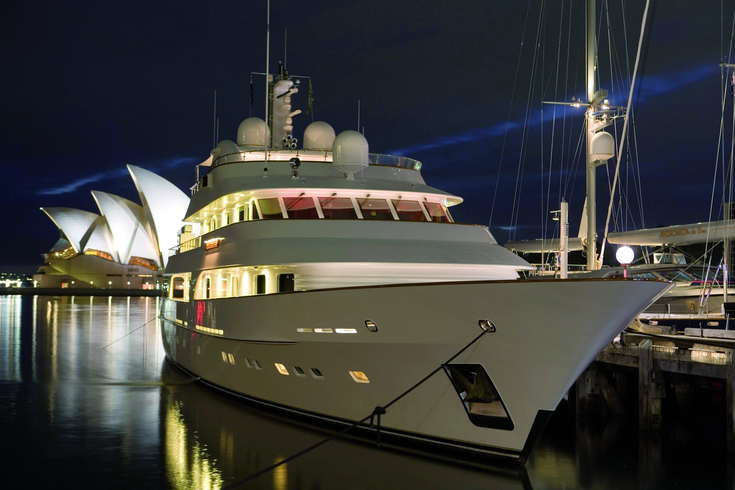 Superyacht berthed beside the Sydney Opera House at night